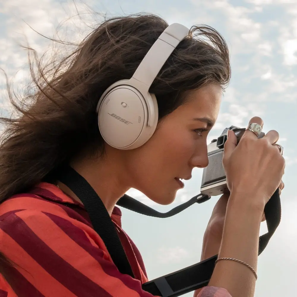 Woman wearing Bose QuietComfort headphones